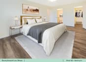 Thumbnail 27 of 31 - a bedroom with a bed and a rug