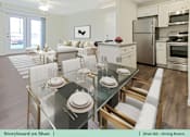 Thumbnail 26 of 31 - a living room and dining room with a glass table and chairs