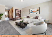 Thumbnail 16 of 30 - a living room with a couch and a coffee table