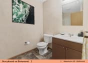 Thumbnail 18 of 30 - a bathroom with a toilet sink and a mirror
