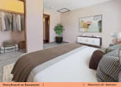 Thumbnail 15 of 30 - a bedroom with a bed and a closet