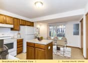 Thumbnail 13 of 27 - a kitchen with an island and a table with chairs