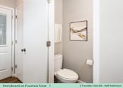 Thumbnail 19 of 27 - a bathroom with a toilet and a white door