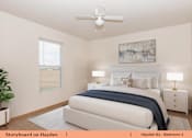 Thumbnail 11 of 17 - a bedroom with a bed and a ceiling fan