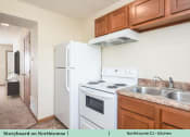 Thumbnail 24 of 29 - a kitchen with a stove refrigerator and sink