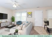 Thumbnail 17 of 30 - a living room with a couch and a coffee table