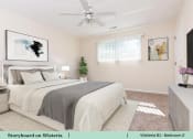 Thumbnail 18 of 30 - a bedroom with a bed and a ceiling fan