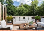Thumbnail 21 of 30 - a patio with white furniture on a wooden deck