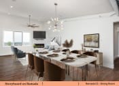 Thumbnail 50 of 58 - a dining room with a table and chairs and a living room