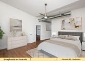 Thumbnail 40 of 58 - a bedroom with a bed and a ceiling fan