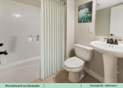 Thumbnail 35 of 58 - a bathroom with a toilet and a sink and a shower