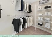 Thumbnail 31 of 58 - a walk in closet with a rack of clothes on the wall