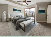Thumbnail 30 of 58 - a bedroom with a bed and a ceiling fan
