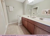 Thumbnail 23 of 58 - a bathroom with a sink and a mirror