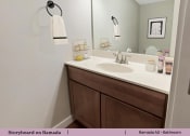 Thumbnail 21 of 58 - a bathroom with a sink and a mirror