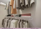 Thumbnail 17 of 58 - a rack of clothes hanging in a closet