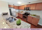 Thumbnail 16 of 58 - a kitchen with stainless steel appliances and granite counter tops