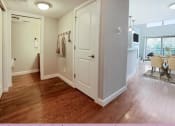 Thumbnail 19 of 58 - an open living room and dining room with a door to a closet