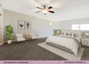 Thumbnail 25 of 58 - a bedroom with a bed and a ceiling fan