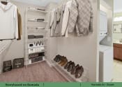 Thumbnail 8 of 58 - a walk in closet with a rack of clothes and shoes