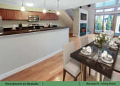 Thumbnail 7 of 58 - a kitchen and dining room with a table and chairs