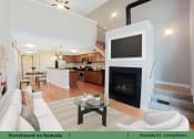 Thumbnail 9 of 58 - a living room with a fireplace and a tv