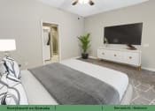 Thumbnail 12 of 58 - a bedroom with a bed and a tv