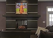 Thumbnail 4 of 23 - A stained glass picture of a cow is hanging above a fireplace in a living room.