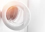 Thumbnail 23 of 23 - A white circular object with a pattern inside is mounted on a white wall.