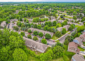 Thumbnail 30 of 31 - A bird's eye view of a residential area with houses and trees.