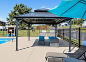 Thumbnail 23 of 27 - Patio with a pool and gazebo at Arbours at Victoria Place in Prattville, AL