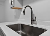 Thumbnail 14 of 32 - Kitchen sink with chrome faucet at Renaissance at Carol Stream in Carol Stream, IL.