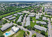 Thumbnail 1 of 32 - Aerial view of the Renaissance at Carol Stream apartment community featuring a swimming pool, located in Carol Stream, IL.