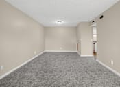 Thumbnail 5 of 27 - Large empty dining room with carpeted floor and white walls at Arbours at Victoria Place in Prattville, AL