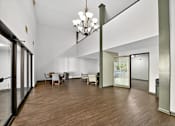 Thumbnail 18 of 34 - A large open space with a dining table and chairs.