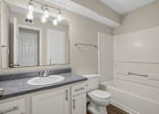 Thumbnail 12 of 27 - Bathroom with a sink, toilet, and bathtub at Arbours at Victoria Place in Prattville, AL