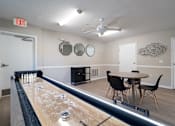 Thumbnail 22 of 32 - Recreation room with shuffleboard at Avalon Place Columbia SC