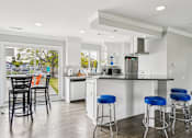 Thumbnail 25 of 32 - Kitchen with bar seating at Bainbridge Park Canton MI