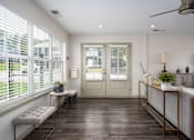 Thumbnail 8 of 23 - Community room with seating at Arbours at Victoria Place Prattville AL