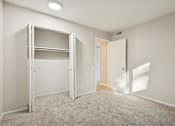 Thumbnail 13 of 26 - A white room with a bunk bed and a door.