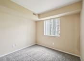 Thumbnail 37 of 39 - A room with a window covered by a white blind.
