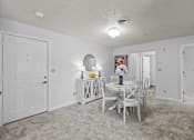 Thumbnail 15 of 39 - a dining room with a white table and chairs and a white door
