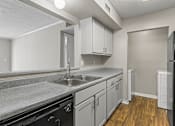 Thumbnail 2 of 25 - Kitchen with wood floors at Park at Meadow Ridge Montgomery AL