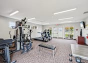 Thumbnail 19 of 32 - Fitness room with equipment at Bainbridge Park Canton MI