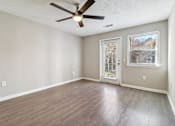 Thumbnail 4 of 32 - Room with hardwood floors and balcony access at Avalon Place Columbia SC