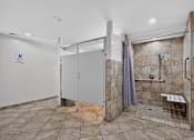 Thumbnail 30 of 32 - Bathroom at Renaissance at Carol Stream featuring a walk in shower and toilet in Carol Stream, IL.