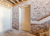 Thumbnail 17 of 32 - A white door is on the left and a beige door is on the right.