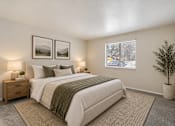 Thumbnail 15 of 39 - A bedroom with a large bed and two framed pictures on the wall.