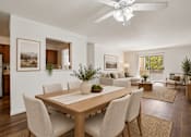 Thumbnail 4 of 35 - A modern dining room with a wooden table and chairs.