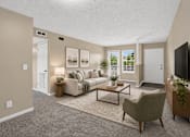 Thumbnail 4 of 27 - Virtually staged living room with a couch, chair, and television at Arbours at Victoria Place in Prattville, AL